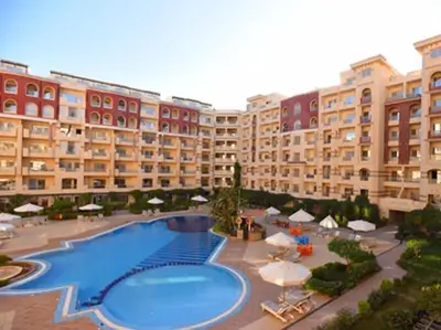 a large apartment building with a large swimming pool at For Rent Florenza Khamsin Residential Apartment in Hurghada