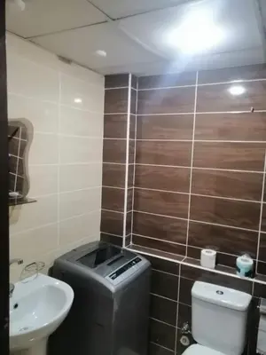 a small bathroom with a toilet and a sink at For Rent Florenza Khamsin Residential Apartment in Hurghada
