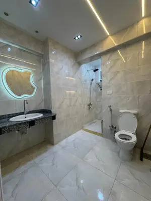 a bathroom with a toilet and a sink at شقه لك ب الكامل فندقي in Safaga