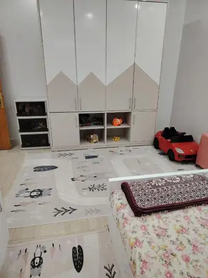 a room with a bed and a rug on the floor at venti house1 in Nag` el-Ramla
