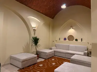 a living room with a couch and a table at Temple Of The Golden Sun in Luxor