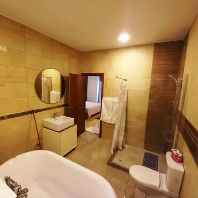 a bathroom with a sink and a toilet and a shower at Entire Oasis Villa - Heart of Ancient Luxor in Luxor