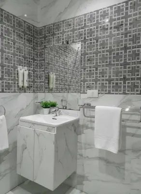 a white bathroom with a sink and a tub at Luxury Panorama Sea View Residence with sky pool in Hurghada