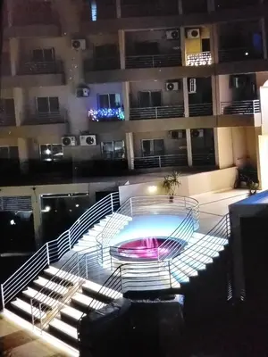 a staircase leading to a pool in a building at Hurghada Pool & See View Studio in Hurghada