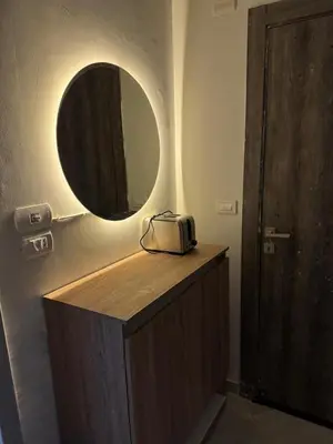 a bathroom with a vanity with a mirror and a sink at Panorama view in Hurghada