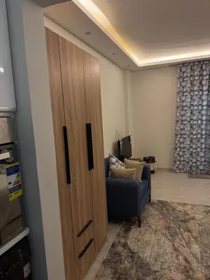 a large wooden door in a living room with a couch at Panorama view in Hurghada
