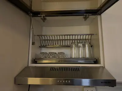 a kitchen with a shelf with glasses on it at Panorama view in Hurghada
