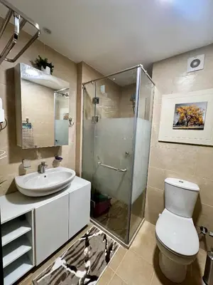 a bathroom with a shower and a toilet and a sink at ALDAU village mall in Hurghada