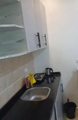 a bathroom counter with a sink and a mirror at شقه بمنتجع كذابلانكا in Hurghada