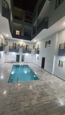 a large swimming pool in a large building at La Luna Garden Magawish in Hurghada