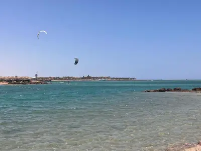 a kite flying over a body of water at 1BR Chalet at Makadi Heights Hurghada in Hurghada