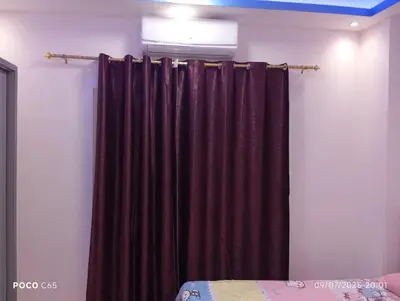 a black curtain in a room with a bed at Red Ruby chalets &flats HRG,Elgouna in Hurghada