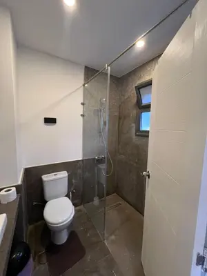 a bathroom with a toilet and a shower at Bali chalet with private heated pool in Hurghada