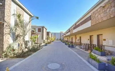 a cobblestone street in front of a building at Elegant Studio in El Gouna in Hurghada