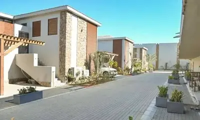 an empty street with a house and some buildings at Elegant Studio in El Gouna in Hurghada