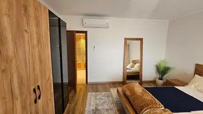 a bedroom with a bed and a large wooden door at Exklusive Ferienwohnung mit traumhafter Meeressicht in Hurghada