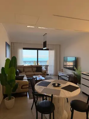 a living room with a couch and a table at Exklusive Ferienwohnung mit traumhafter Meeressicht in Hurghada