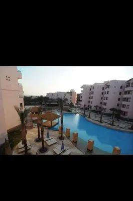 a view of a large swimming pool in a city at قريه الدهبيه in Hurghada