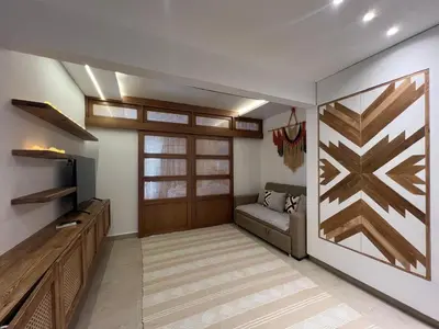 a living room with a couch and a wooden door at Maraya El Gouna in Hurghada