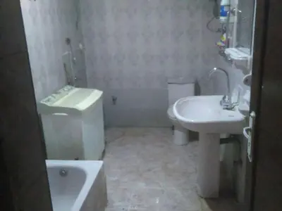 a bathroom with a sink and a toilet and a sink at Tetas Villa in Naj‘ al Maḩaţţah