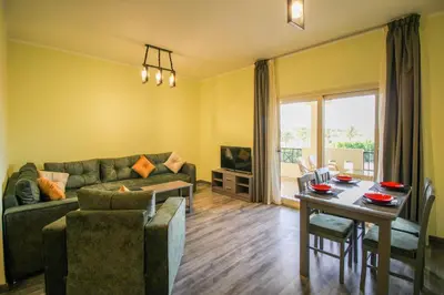 a living room with a couch and a table at All View Apartements, Sahl Hasheesh, El Andalous in Hurghada