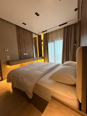a bedroom with a large bed with a window at Luxury Sea View Apartment Near Hurghada Airport in Hurghada