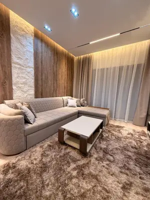 a living room with a couch and a table at Luxury Sea View Apartment Near Hurghada Airport in Hurghada