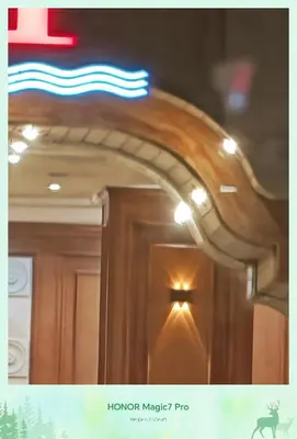 a wooden door with a light on top of it at Hambra avenue resort in Hurghada