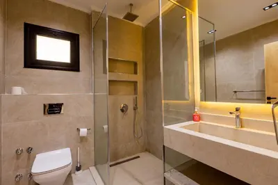 a bathroom with a shower and a toilet and a sink at Private Villa AL Mamsha Private Pool in Hurghada