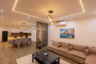 a living room with a couch and a table at Private Villa AL Mamsha Private Pool in Hurghada