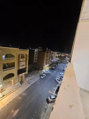 an aerial view of a parking lot at night at Sky View in Hurghada