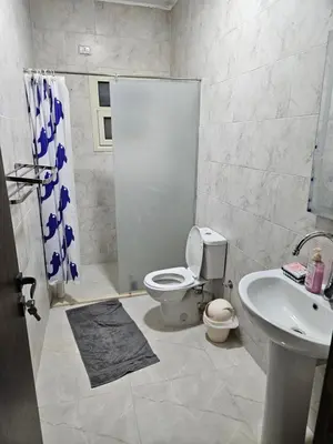 a bathroom with a toilet and a sink at Sky View in Hurghada