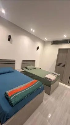 a bedroom with two beds in a room at Humbra in Hurghada
