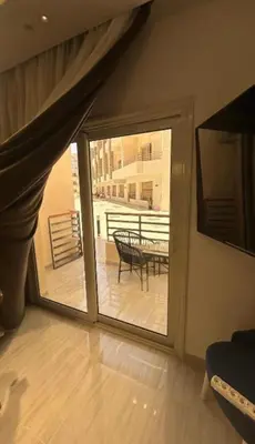 a room with a sliding glass door to a patio at Humbra in Hurghada