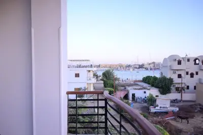 a view of a city from a balcony at Qasr El Nil in Luxor
