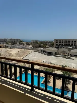 a view of a pool from a balcony at Lotus Al-Dau Heights in Hurghada