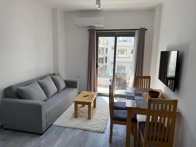 a living room with a couch and a table at Imperial Resort App 433 in Hurghada