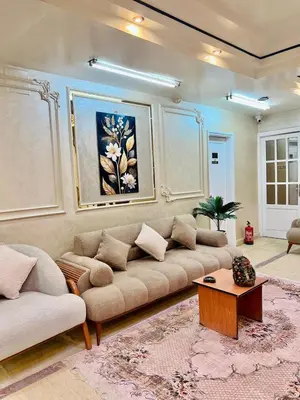 a living room with a couch and a table at Aswan City Center Hotel in Aswan