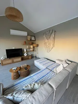 a living room with a couch and a table at Bali elgouna private heated pool in Hurghada