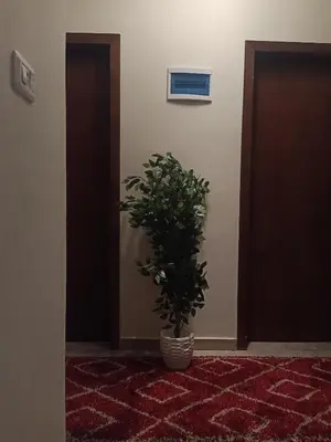 a potted plant sitting on the floor in a hallway at Sky Star Villa 97 in Hurghada