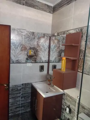 a bathroom with a sink and a mirror at Sky Star Villa 97 in Hurghada