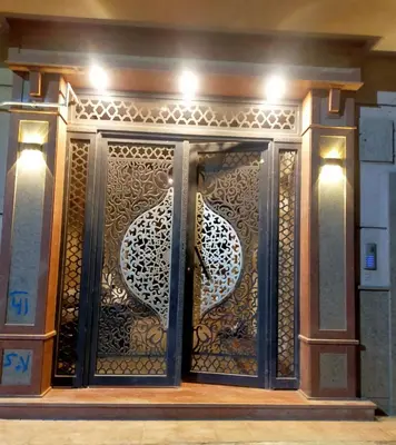 a gate with a design on it in a building at happy apartment in Luxor