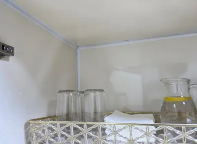 a shelf with three glass jars in a refrigerator at Hobby live in Hurghada in Hurghada