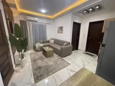 a living room with a couch and a table at اوسيس مارينا in Hurghada