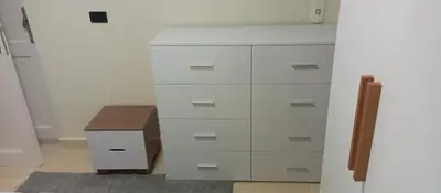 a white dresser with a drawer in a room at Cozy flat in Makadi Heights in Hurghada