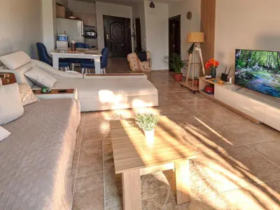 a living room with a couch and a tv at Apartman v Hurgade 2 izbovy , v rezorte Florenza,plne zariadeny in Hurghada