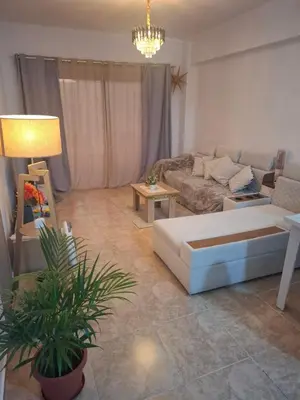 a living room with a couch and a table at Apartman v Hurgade 2 izbovy , v rezorte Florenza,plne zariadeny in Hurghada