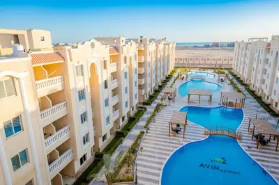 an aerial view of a resort with two pools at Avin Resort in Hurghada