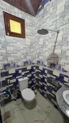 a bathroom with a toilet and a sink at Sheba Kato in Jazīrat Aswān