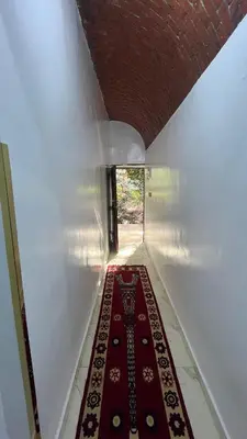 a hallway with a red carpet on the floor at Sheba Kato in Jazīrat Aswān